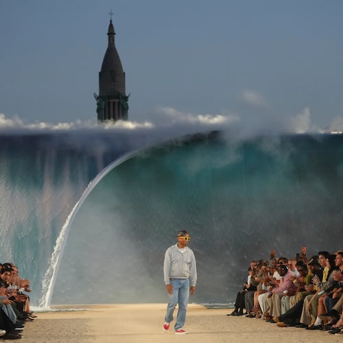 Designer Pharrell Williams accepts applause afte the Louis Vuitton men's Spring Summer 2027 collection presented in Paris, France, Tuesday, June 23, 2026. (AP Photo/Aurelien Morissard)