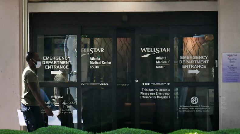 A patient enters Wellstar Atlanta Medical Center South in East Point, GA, the week before Wellstar shut down the facility's hospital services such as its emergency room and hospital beds.  Wellstar then converted the facility to an urgent care clinic.  (Hyosub Shin / Hyosub.Shin@ajc.com)
