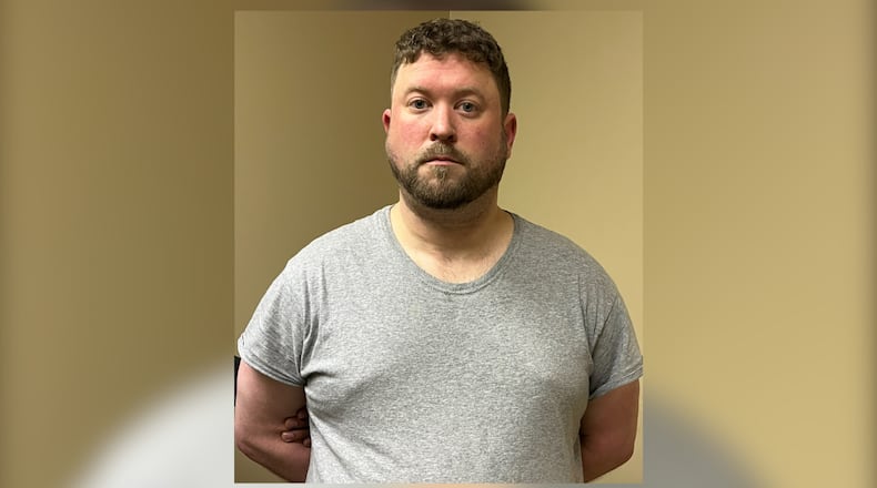 Forest Park police Officer James Kea was booked into the Fulton County jail on several charges, including identity fraud, stalking and computer trespass.