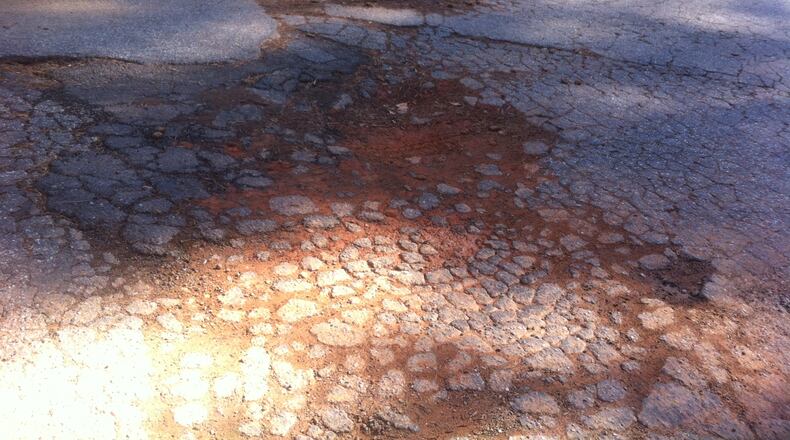 A reader hopes a series of potholes will soon be fixed on Stratmor Drive in DeKalb County. Photo/Submitted.