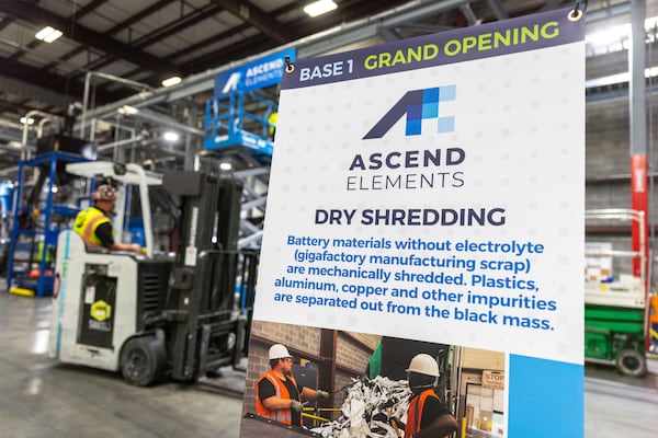 A sign inside Ascend Elements’ facility in Covington mentions a grand opening.  (Arvin Temkar/AJC 2023)