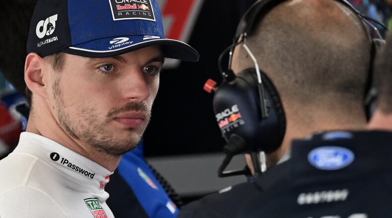 Red Bull driver Max Verstappen of the Netherlands, left, prepares for the qualifying session ahead of the British F1 Grand Prix, in Silverstone, England, Saturday, July 4, 2026. (Peter Powell/Pool via AP)