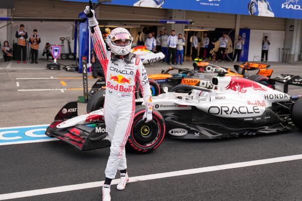 Red Bull driver Max Verstappen of the Netherlands celebrates after the qualifying session for the Japanese Formula One Grand Prix at the Suzuka Circuit in Suzuka, central Japan, Saturday, April 5, 2025. (AP Photo/Shuji Kajiyama)