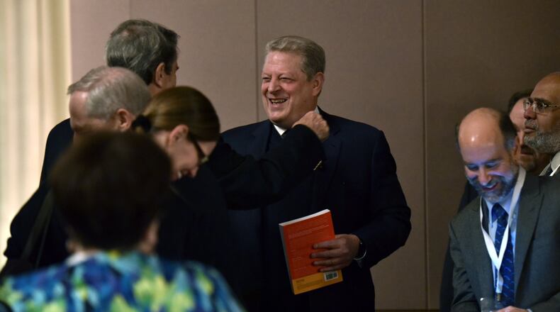 Feb. 16, 2017 Atlanta - Former vice president Al Gore (center) is greeted by participants during Climate & Health Meeting at the Carter Center on Thursday, February 16, 2017. The conference was cancelled by the U.S. Centers for Disease Control and Prevention in the aftermath of Donald Trump’s election victory, but was later rescheduled and moved to the Carter Center. HYOSUB SHIN / HSHIN@AJC.COM