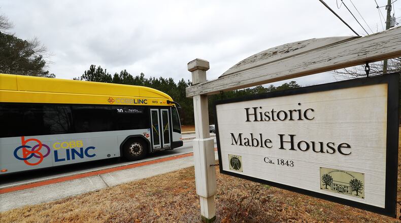 A CobbLinc bus passes by the historic Mable House on Floyd Road on Thursday, Feb. 17, 2022, in Mableton. “Curtis Compton / Curtis.Compton@ajc.com”`
