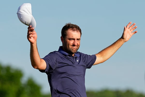 Scottie Scheffler celebrates after winning the PGA Championship golf tournament at the Quail Hollow Club, Sunday, May 18, 2025, in Charlotte, N.C. (AP Photo/George Walker IV)