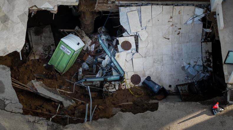 An aerial view of a sinkhole which collapsed the driveway of a coastal mansion owned by actor Nicolas Cage Tuesday, Sept. 8, 2026, in Malibu, Calif. (AP Photo/Ethan Swope)