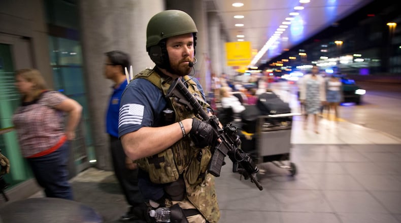 Police search for a gunman at Fort Lauderdale-Hollywood International Airport on Friday. Five people were killed and eight wounded in an attack from a single gunman near the baggage claim area in terminal 2. (Allen Eyestone / The Palm Beach Post)