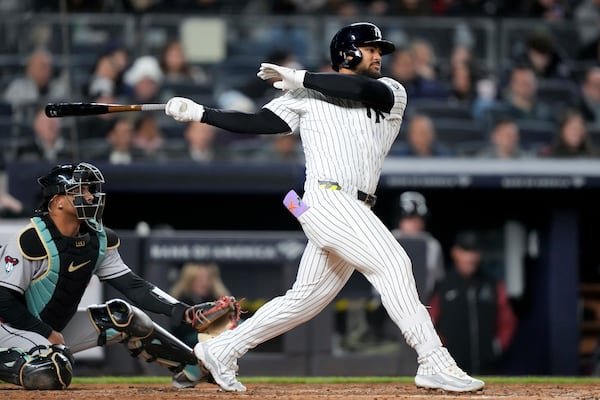 New York Yankees' Jasson Domínguez singles on a line drive during the fourth inning of a baseball game against the Arizona Diamondbacks, Tuesday, April 1, 2025, in New York. (AP Photo/Julia Demaree Nikhinson)