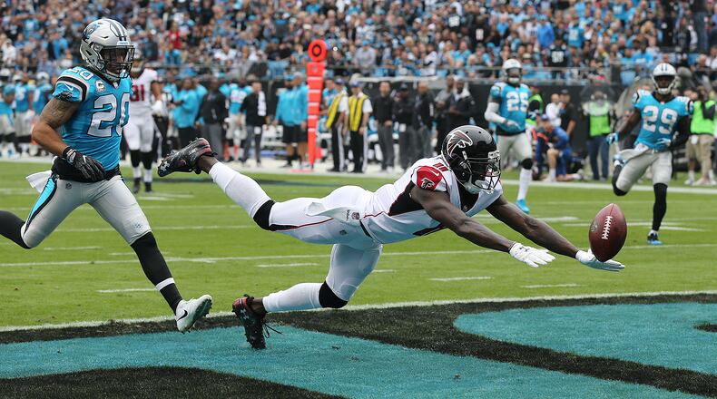 The Falcons offense continues to misfire with wide receiver Julio Jones just missing a Matt Ryan touchdown pass during the first half as Panthers safety Kurt Coleman defends in a NFL football game on Sunday, November 5, 2017, in Charlotte. Julio Jones also dropped a touchdown pass in the endzone during the second half in a 20-17 loss to the Panthers. Curtis Compton/ccompton@ajc.com