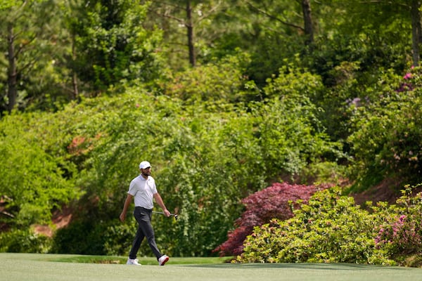 Scottie Scheffler walks to the green on the 13th hole during the first round at the Masters golf tournament, Thursday, April 10, 2025, in Augusta, Ga. (AP Photo/David J. Phillip)