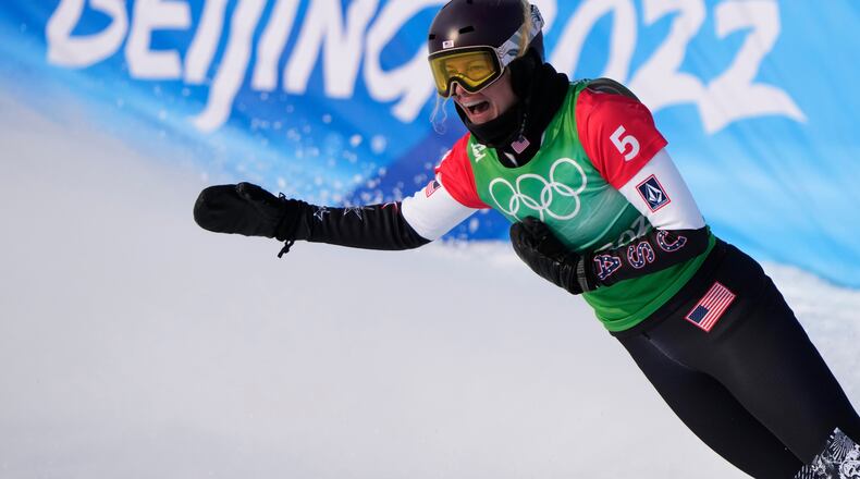 FILE - United States' Lindsey Jacobellis celebrates after winning a gold medal in the women's cross at the 2022 Winter Olympics, Feb. 9, 2022, in Zhangjiakou, China. (AP Photo/Lee Jin-man, File)