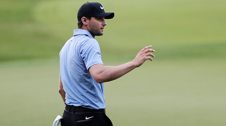 Kyle Stanley waves to the crowd as he walks off the 18th hole after finishing the first round of the Tour Championship golf tournament at East Lake Golf Club in Atlanta, Thursday, Sept. 21, 2017. (AP Photo/David Goldman)