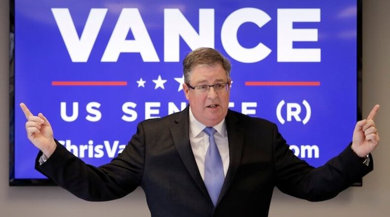 GOP U.S. Senate candidate Chris Vance extends his arms as he talks about how far apart the two major parties are while speaking at a news conference Thursday, May 5, 2016, in Seattle. The Republican candidate for U.S. Senate in Washington state says he can't support Donald Trump as his party's nominee. Vance, who is running against incumbent Democratic U.S. Sen. Patty Murray, said Thursday that unless a conservative third-party alternative comes forward by November, he won't vote for president in the election. (AP Photo/Elaine Thompson)