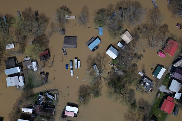 Camp Turn-A-Bout is flooded by the rising Ohio River at the Gunpowder Creek, Monday, April 7, 2025, in Union, Ky. (AP Photo/Carolyn Kaster)