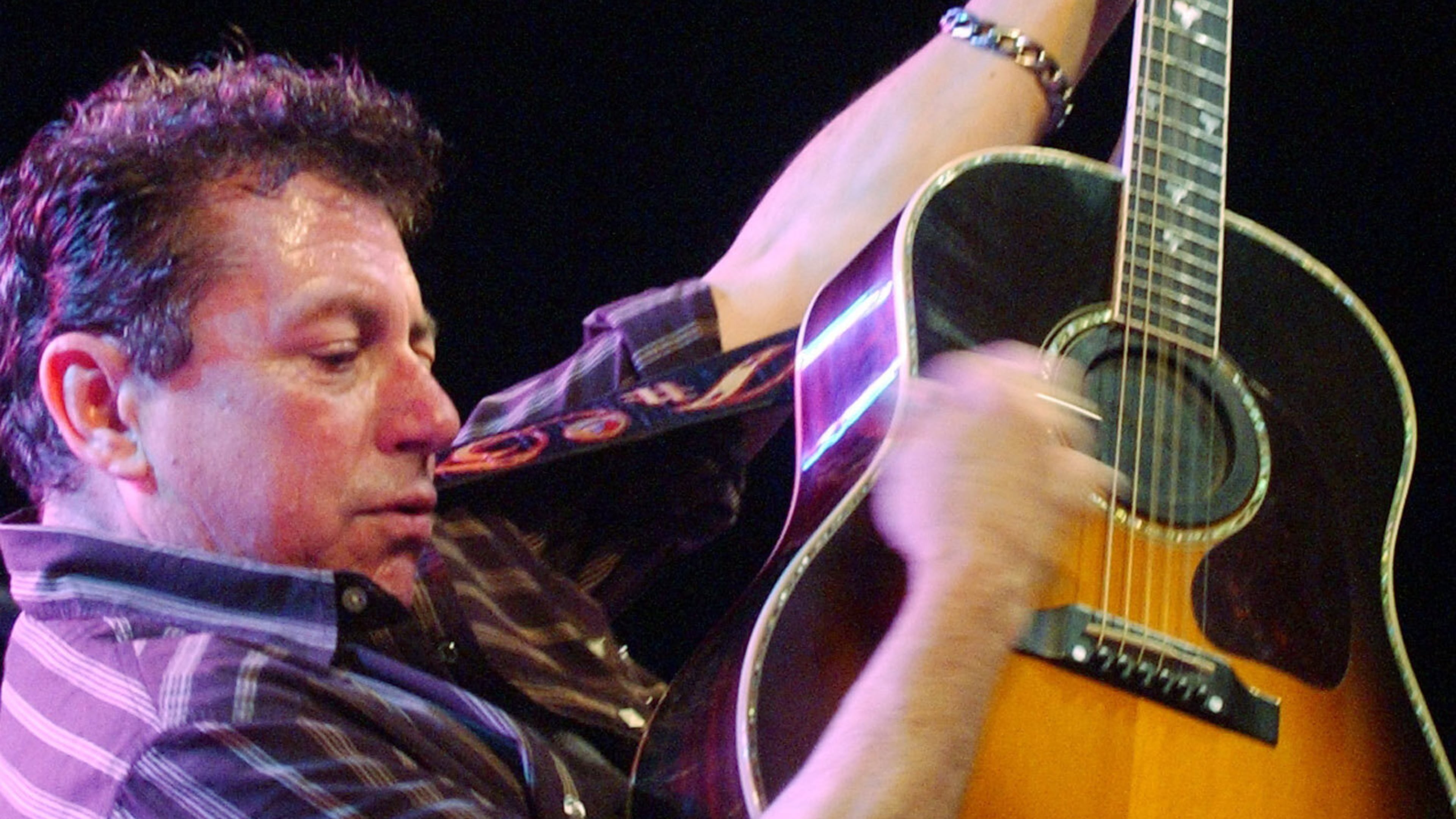 FILE - Joe Ely performs during the "Tsunami Relief — Austin to South Asia" concert at the Austin Music Hall in Austin, Texas Sunday, Jan. 9, 2005. (AP Photo/Kelly West, file)