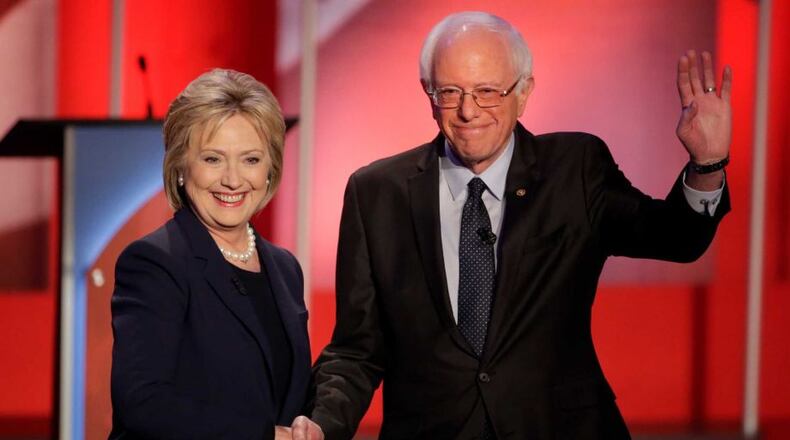 Hillary Clinton and Bernie Sanders make nice. AP Photo.