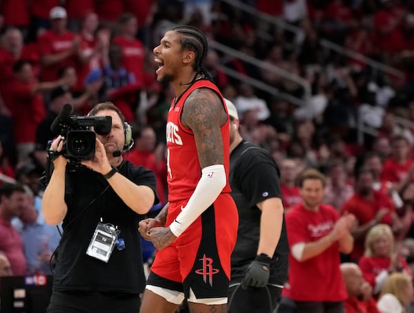 Houston Rockets guard Jalen Green (4) reacts after a basket against the Golden State Warriors during the second half of Game 2 of an NBA basketball first-round playoff series against the Houston Rockets in Houston, Wednesday, April 23, 2025. (AP Photo/Karen Warren)