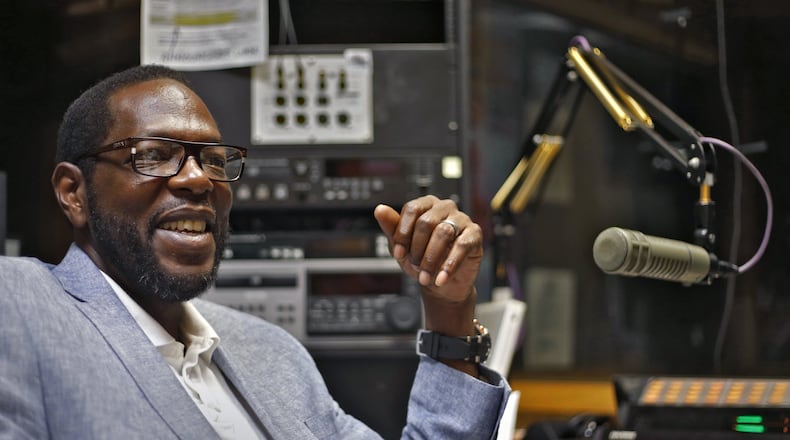 Morris Baxter, the morning drive host of WCLK radio, in his broadcast booth in Woodruff Library at Clark Atlanta University. BOB ANDRES / BANDRES@AJC.COM