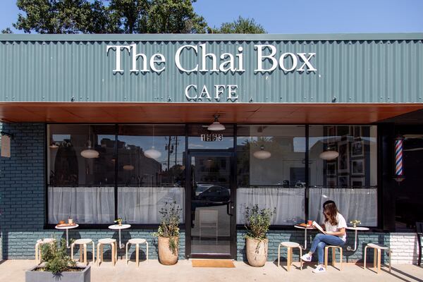 The exterior of a tea shop called the Chai Box Cafe on a sunny day