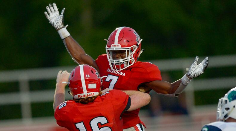 Buccaneers running back Alex Wilson (7) celebrates with tight end Jay Ellison (16) after Ellison scores a touchdown against Creekview on September 6, 2019. (Daniel Varnado/Special)