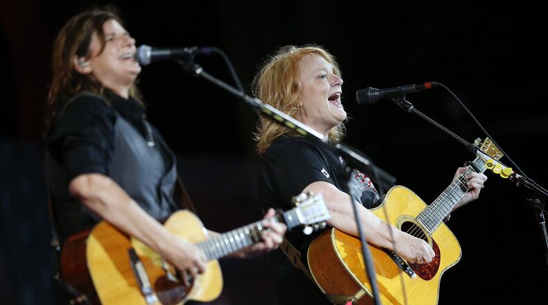 The Indigo Girls - Amy Ray (left) and Emily Saliers - perform during rehearsal for the Boston Pops Fireworks Spectacular in Boston, Tuesday, July 3, 2018. (AP Photo/Michael Dwyer)