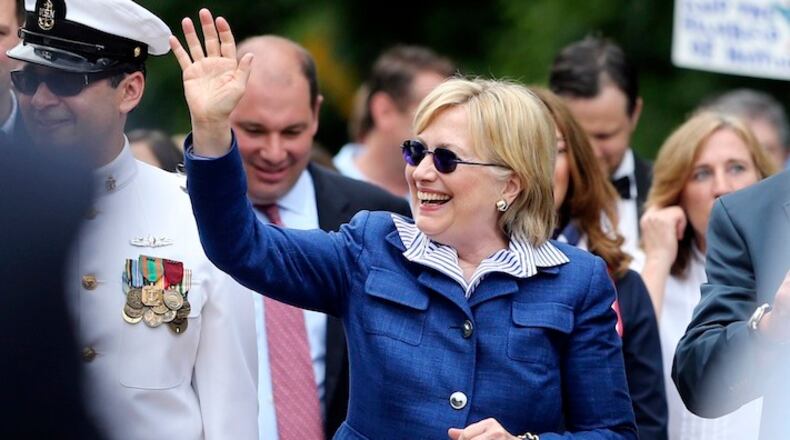 Democratic presidential candidate Hillary Clinton waves as she walks in a Memotial Day parade Monday, May 30, 2016, in Chappaqua, N.Y. (AP Photo/Mel Evans)