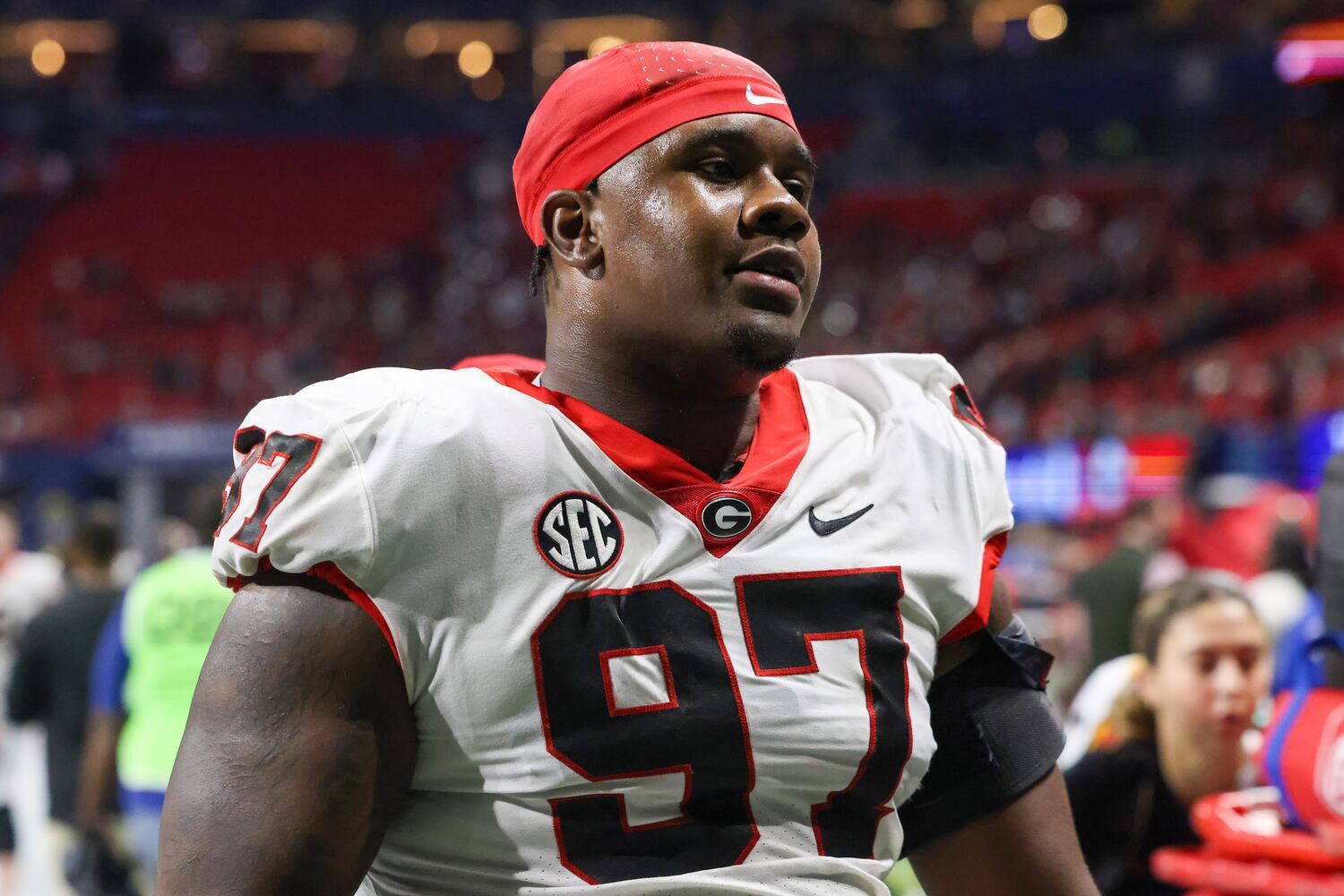 Georgia Bulldogs defensive lineman Warren Brinson (97) walks off the field following the SEC Championship football game at the Mercedes-Benz Stadium in Atlanta, on Saturday, December 2, 2023. Alabama defeated Georgia 27-24 to end the Bulldogs’ 29-game winning streak. (Jason Getz / Jason.Getz@ajc.com)