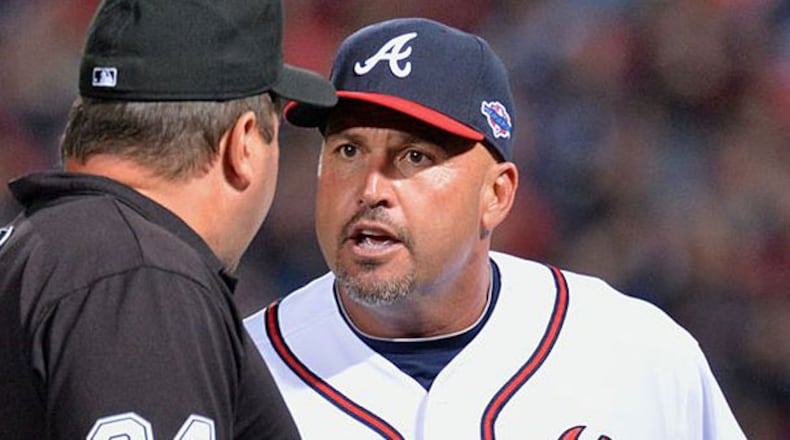 Braves manager Fredi Gonzalez appeals to umpire Sam Holbrook about the ruling.