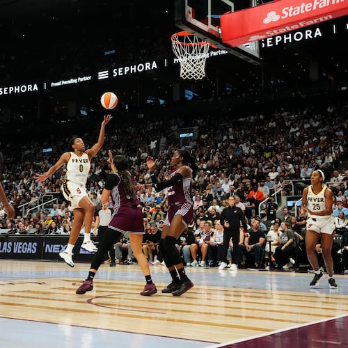 Indiana Fever's Kelsey Mitchell (0) scores past the Toronto Tempo defence during the first half of a WNBA basketball game in Toronto on Tuesday, Aug. 18, 2026. (Chris Young/The Canadian Press via AP)