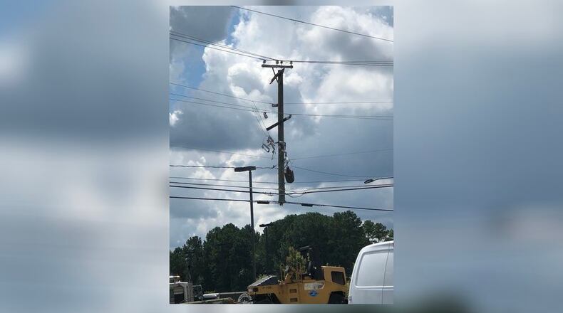 This power pole was damaged in a five-car crash in Conyers.