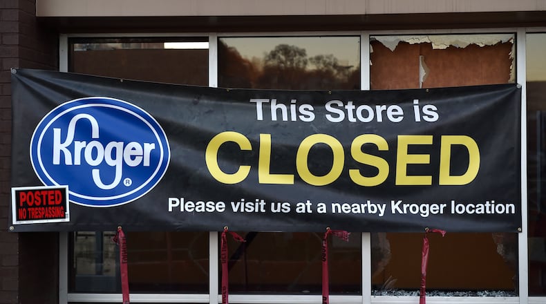 A closed sign hangs in the window of the Kroger at 725 Ponce De Leon Ave. in 2016.