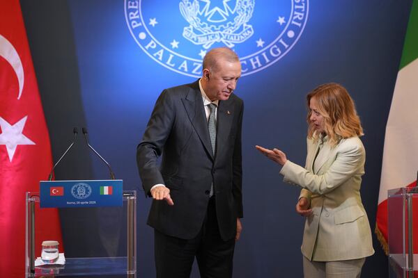 Turkish President Recep Tayyip Erdogan, left, and Italian Premier Giorgia Meloni arrive for a joint press conference after their meeting, at Villa Pamphilj in Rome, Tuesday, April 29, 2025. (AP Photo/Francisco Seco)