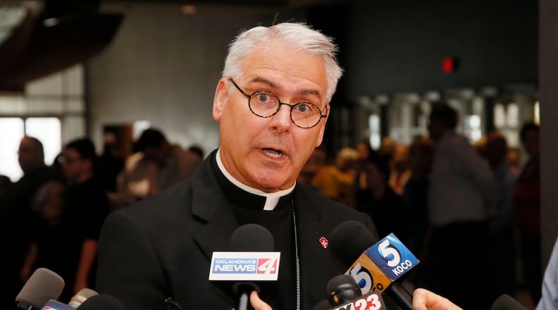 FILE - Archbishop Paul Coakley speaks to the media before the Beatification Ceremony for Stanley Rother in Oklahoma City, Sept. 23, 2017. (AP Photo/Sue Ogrocki, File)