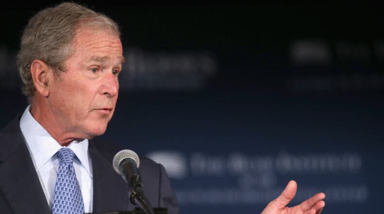 Former U.S. President George W. Bush addresses a summit on "creating employment opportunities for post-9/11 veterans and military families" at the U.S. Chamber of Commerce June 24, 2015 in Washington, DC. (Photo by Chip Somodevilla/Getty Images)