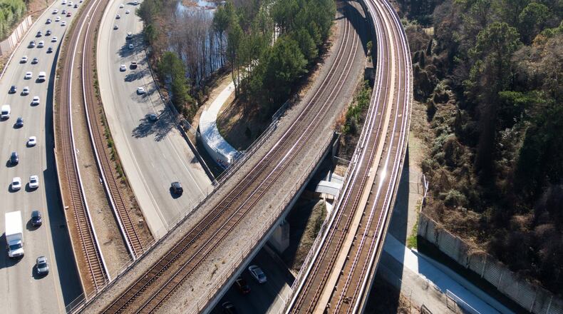 This aerial photo shows a new segment of PATH400, which is nearly complete but still closed, along Ga. 400 southbound on Dec. 19, 2019. The PATH400 through Buckhead is broken into two pieces, but this new section slated to open early next year will connect them, completing the ride through one of the busiest parts of Atlanta. New links like this are being forged in broken paths across metro Atlanta to create a regional network that could serve as an alternative to roads. HYOSUB SHIN / HYOSUB.SHIN@AJC.COM