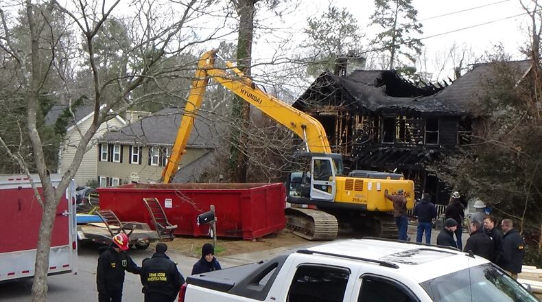 Gwinnett County fire investigators returned Thursday to a home where a woman and her two daughters died in a fire. (Photo: Gwinnett fire department)