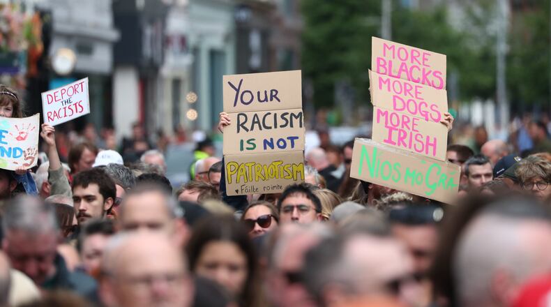 People gather during an anti-racism rally outside Belfast City Hall sparked by a knife attack on a man in north Belfast on Monday, in Belfast, Saturday June 13, 2026. (Peter Morrison/PA via AP)