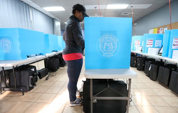 Yolanda Norman of DeKalb County uses te new voting machines at Voter Registration and Elections Office in Atlanta on Monday, March 2, 2020. Miguel Martinez for the Atlanta Journal-Constitution