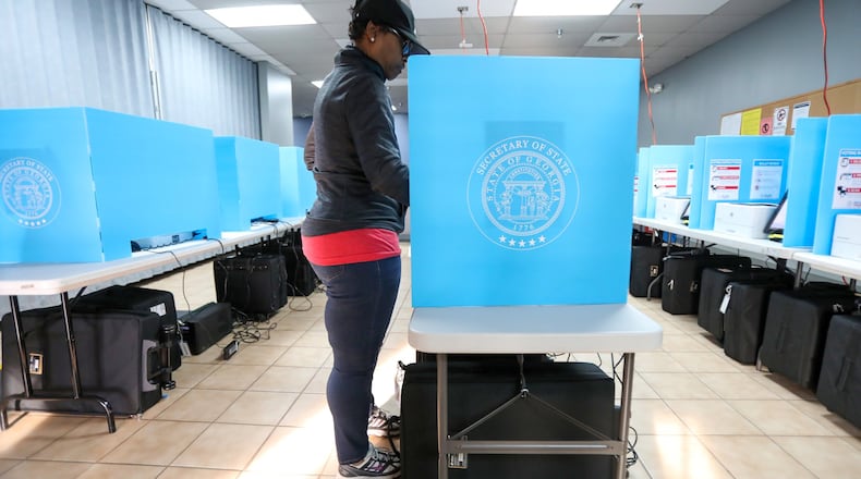 Yolanda Norman of DeKalb County uses te new voting machines at Voter Registration and Elections Office in Atlanta on Monday, March 2, 2020. Miguel Martinez for the Atlanta Journal-Constitution