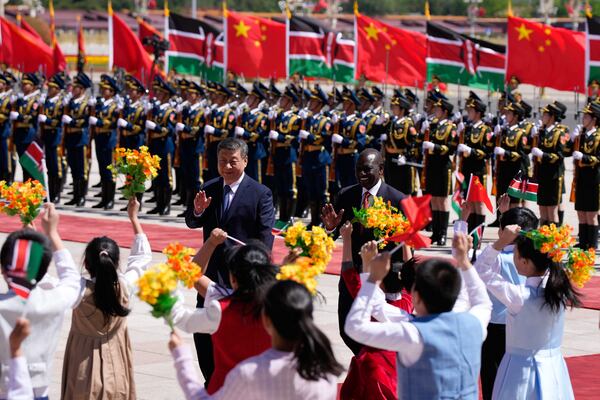 Chinese President Xi Jinping, center left, and Kenyan President William Ruto attend a welcome ceremony at the Great Hall of the People in Beijing Thursday, April 24, 2025. (Iori Sagisawa/Pool Photo via AP)
