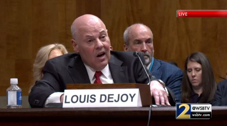 Postmaster General Louis DeJoy speaks before the U.S. Senate during a hearing Tuesday to discuss widespread mail delays.