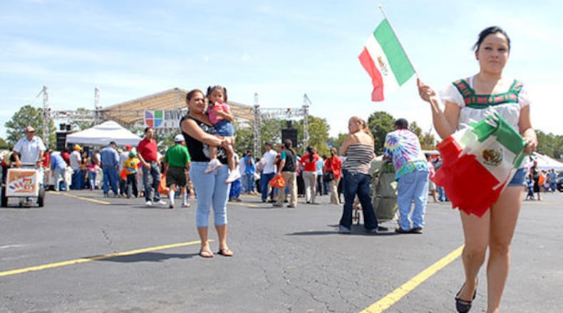 Susana Olague sells Mexican flags during the celebration at Plaza Fiesta.
