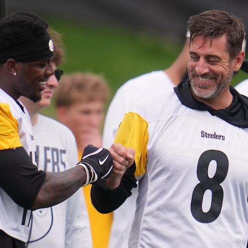 Pittsburgh Steelers quarterback Aaron Rodgers (8) fist bumps wide receiver Germie Bernard, left during the NFL team's training camp in Latrobe, Pa., Saturday, Aug. 1, 2026. (AP Photo/Gene J. Puskar)