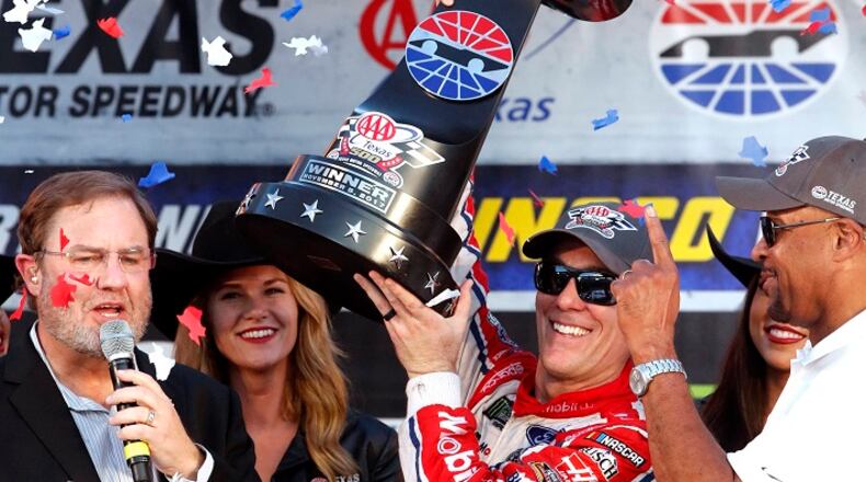 Kevin Harvick (4) displays his trophy for winning the Texas AAA 500 at Texas Motor Speedway on Sunday, Nov. 5, 2017. Harvick took the lead in the last 10 laps. (Bob Booth/Fort Worth Star-Telegram/TNS)