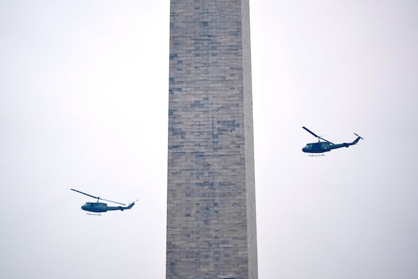 U.S. Army UH-60M Black Hawk helicopters perform a flyover during an event to honor the Army's 250th anniversary, coinciding with President Donald Trump's 79th birthday, Saturday, June 14, 2025, in Washington. (AP Photo/Mark Schiefelbein)