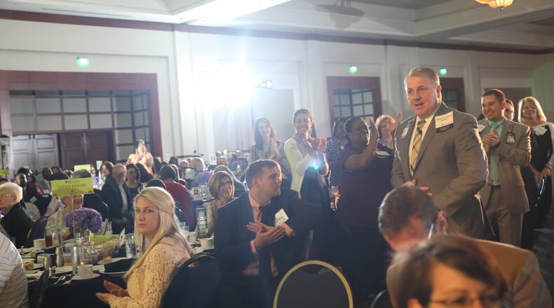 Described by one of his nominators as a “nurse’s nurse,” WellStar’s Stuart Downs walks up to receive his award at the Celebrating Nurses luncheon in May.