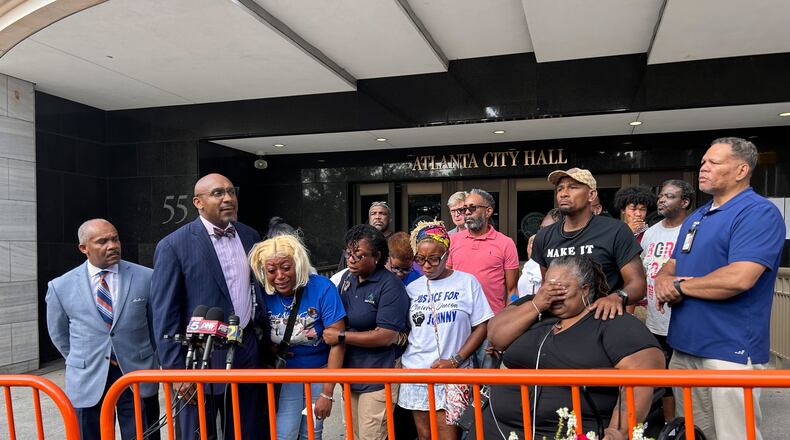 Attorney Mawuli Davis speaks outside Atlanta City Hall on Friday after the family of Johnny Hollman viewed body camera footage leading up to the 62-year-old's death Aug. 10.