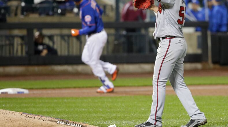Braves pitcher Jaime Garcia reacts as New York Mets’ Wilmer Flores runs the bases after hitting a two-run home run during the sixth inning Thursday. (AP Photo/Frank Franklin II)