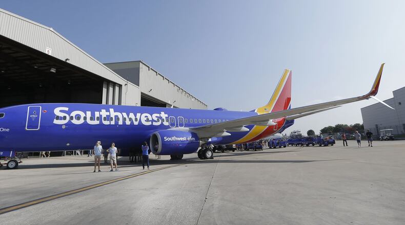 A Southwest Airlines jet at Love Field in Dallas, where the airline grew into a national powerhouse. Now it is locked in a battle with Delta Air Lines over Delta’s use of gate space there. (AP Photo/LM Otero, File)